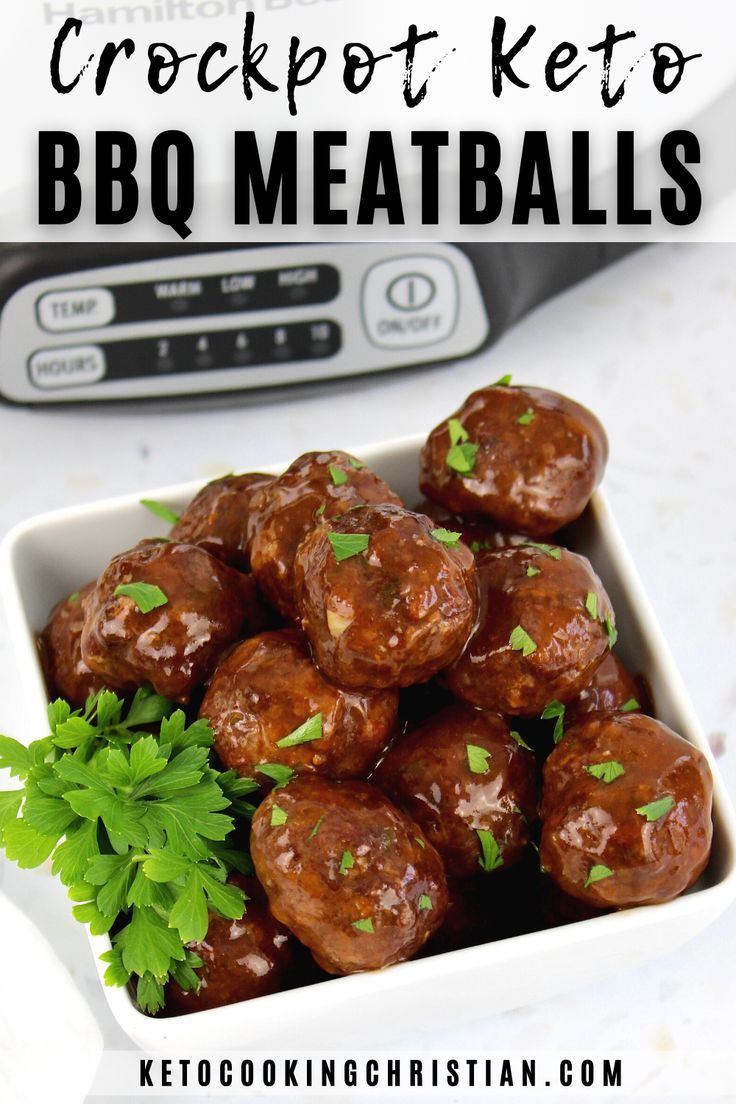 a white bowl filled with meatballs and garnished with parsley