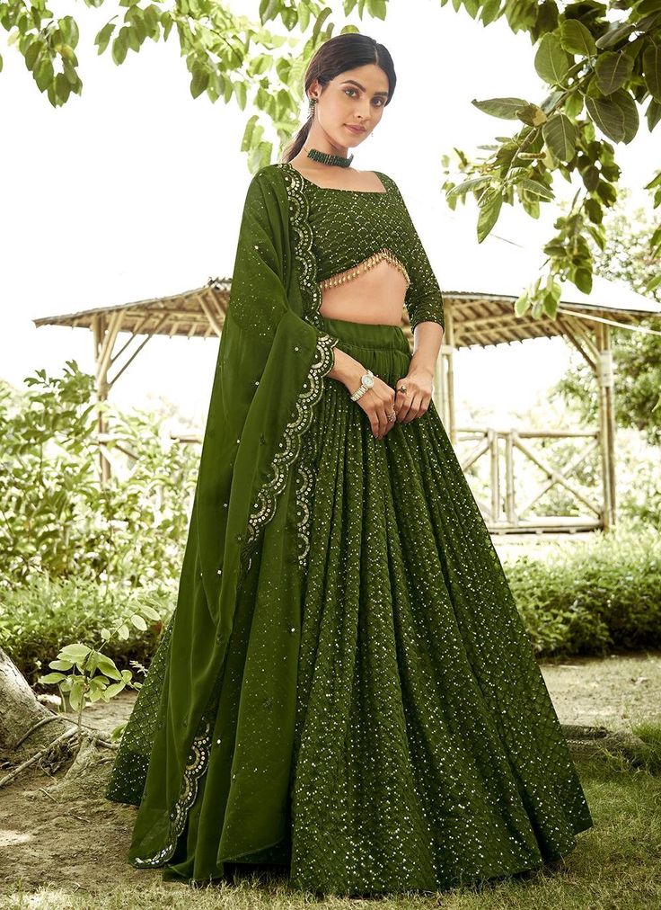 Introducing our exclusive Mehndi Green Lehenga Choli, perfect for Indian weddings and festive occasions. Made of high quality Georgette fabric and adorned with stunning sequins, this ready-to-wear Lahanga Choli will make you stand out from the crowd. Get ready to make a statement in this eye-catching Lengha Choli! The unstitched blouse can be customized upto 46 inches. Do Note: All the accessories shown are for styling purpose only. Slight color variation may occur due to photographic reasons. O Mehndi Green Lehenga, Sequins Lehenga Choli, Indian Wedding Party, Sequins Lehenga, Green Lehenga Choli, Ghaghra Choli, Lehenga Choli For Women, Choli For Women, Lengha Choli