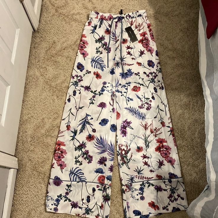 Excellent Condition White Multi Wildflower Spring Floral Print Wide Leg Loungewear Pants, Spring Floral Print Wide Leg Pants For Loungewear, Printed Wide Leg Pants For Spring Loungewear, Floral Print Wide Leg Bottoms For Brunch, Fitted Floral Print Wide Leg Pants For Spring, Spring Brunch Wide Leg Trousers, Scallop Pants, Black Linen Pants, Cream Trousers