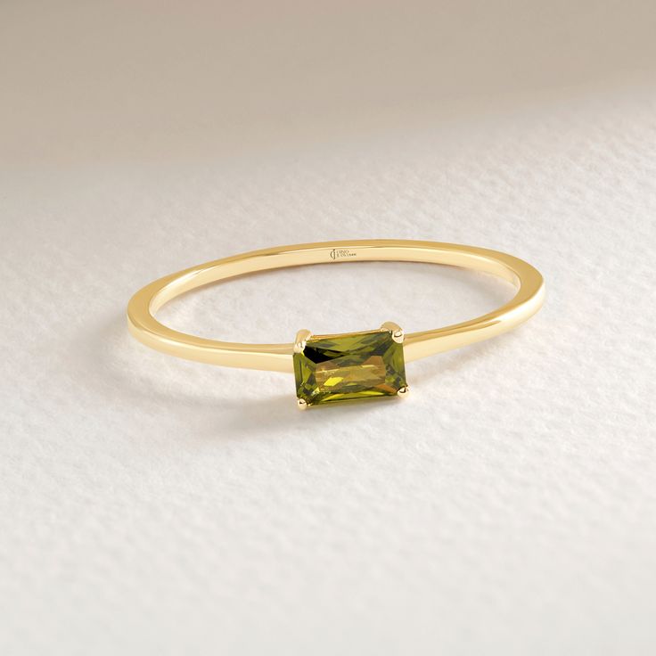 Our Dainty 14K Gold Baguette Peridot Ring will be best birthstone gift for Girlfriend!  This 10K Birthstone Jewelry will be perfect gift for your lovely Bestie, best friend or bff. 18K Birthmonth Band  can be switched with Bf birthstone and turns to brilliant stackable 10K birthstone ring for your girl friend. Our Custom Green Stoned Keepsake Jewelry will be great green stacking ring in her daily life also! This gold peridot ring will be exact match with oval horizontal green peridot gifted ring or other 14K birth stone ring for her. This Sturdy and Stunning solitaire band  has symbolizing your everlasting love & serves as a perfect keepsake jewelry gift for Best Friends. Please check our other birthstone gold rings: https://www.etsy.com/shop/Cristojuanna?ref=seller-platform-mcnav&section_ Solitaire Bands, Girl Friend, Birthstone Gifts, Peridot Ring, Keepsake Jewelry, Green Peridot, Rings For Her, Stacking Ring, Birthstone Ring