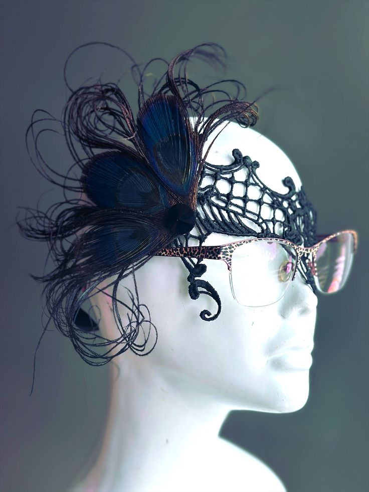 The beauty of peacock feathers in rare black shade combined with intricate black lace, designed to fit comfortably over glasses. Perfect for those who want to add a touch of sophistication and mystery to their look while keeping their eyewear on. Make a striking impression with your glasses on!


Age Group/Gender - Adult/Women

Size/Type - One size fits all adults

Mask Color - Black

Mask Material - Lace & Feathers Adjustable Black Eye Mask For Masquerade, Green Masquerade Mask, Kids Party Packs, Metal Mask, Feather Mask, Green Feather, Female Mask, Lace Mask, Eye Glass