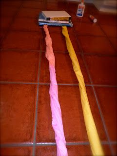 two toothbrushes laying on the floor next to each other