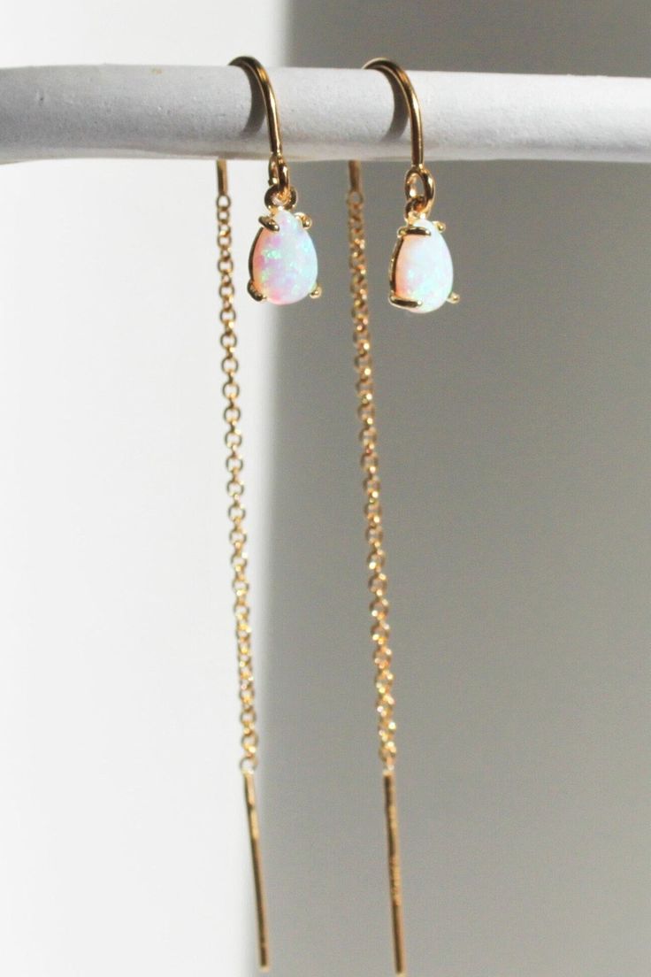 These Opal Drop Earrings are a beautiful touch of sparkle for your everyday. High quality 14ktgold filled theader earrings with tiny teardrop opals, a perfect gift for her or you! D E T A I L S These gorgeous earrings are created with high quality 14kt Gold Filled ear threaders. Attached to the end is a tiny synthetic opal teardrop. ∙ EXTRA LOVE ∙ Crafted and curated just for you in the desert of our Arizona studio. All of our jewelry comes gift packaged! We are happy to leave a note if this is Opal Earrings Dangle, Gold Threader Earrings, Jewelry Gold Earrings, Simple Silver Earrings, Tiny Gold Earrings, Large Drop Earrings, Simple Gold Earrings, Bridesmaid Gifts Earrings, Opal Drop Earrings