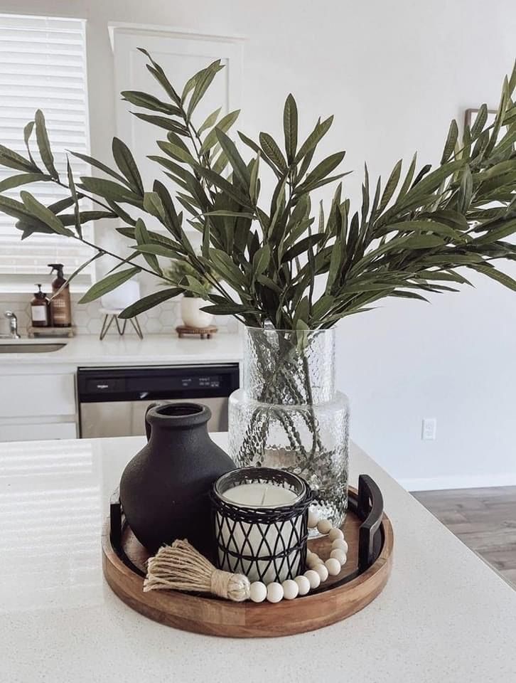 there is a vase with some plants in it