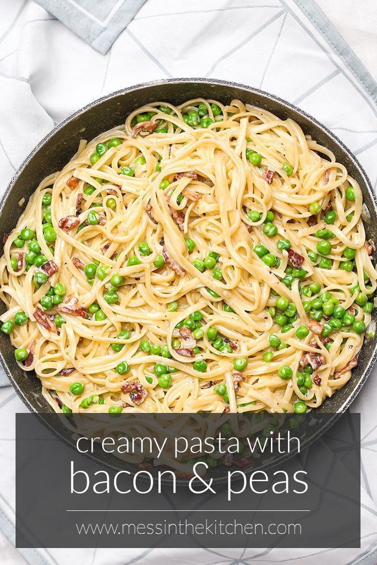 creamy pasta with bacon and peas in a skillet on a white tablecloth, with text overlay