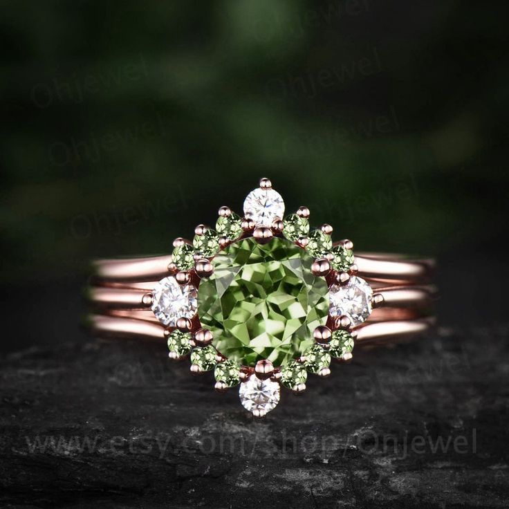 "This is a natural peridot engagement ring in solid gold,about 7mm 1.3ct round cut.  The accent stones are round 3mm moissanites. The matching band stones are round peridot and moissanites. The band width about 1.3-1.4mm. It can be made in any ring size. However please contact me to custom make it to a special big or small size. It can be made in white gold,rose gold or yellow gold with 14k or 18k. However for some people who are nickel allergic,I can also make it to 925 sterling silver to make you can wear it. The ring is handmade,very high quality! 30 days money back guarantee. Returns & Warranty 30-Day money back guarantee (starting from the day of delivery). \"Made to Order\" purchases qualify for our 30-day money back guarantee. The 30-day money back guarantee gives you time to make s Elegant Three Stone Peridot Ring, Wedding Jewelry With Peridot In Halo Setting, Wedding Jewelry With Prong Set Peridot, Wedding Jewelry With Prong Setting And Peridot, Wedding Jewelry With Peridot In Prong Setting, Stackable Peridot Wedding Jewelry, Round Peridot Three Stone Jewelry, Round Peridot Three-stone Jewelry, Wedding Stackable Peridot Rings