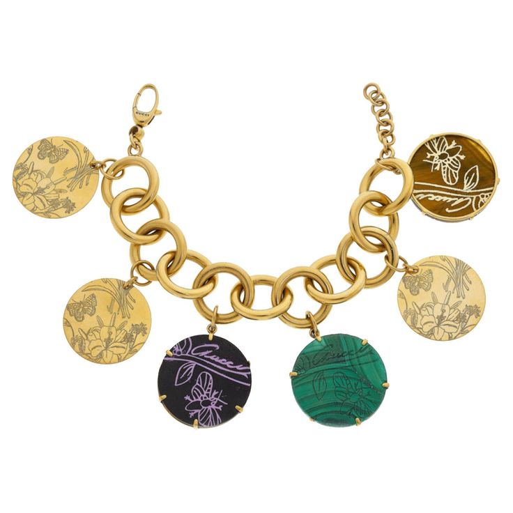 Gucci 18k Gold Multi-Stone Bracelet Charm bracelet, Butterfly, Flowers set in Round malachite, tiger's-eye, black hardstone tablets Marked Gucci made in Italy 17. Gross Weight: 59.6 dwts Charm Diameter: 1-1/4 inches Bracelet Length: 7-1/2 inches (adjustable) Gucci Bracelet, Bracelet Butterfly, Rings Luxury, Bracelet Charm, Butterfly Flowers, Tiger's Eye, Multi Stone, Eye Black, Stone Bracelet