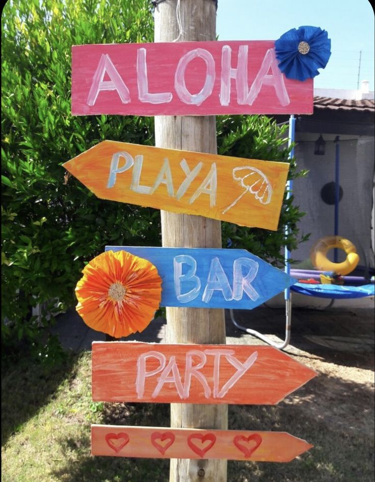 a wooden sign that says aloha, playa bar and party on it