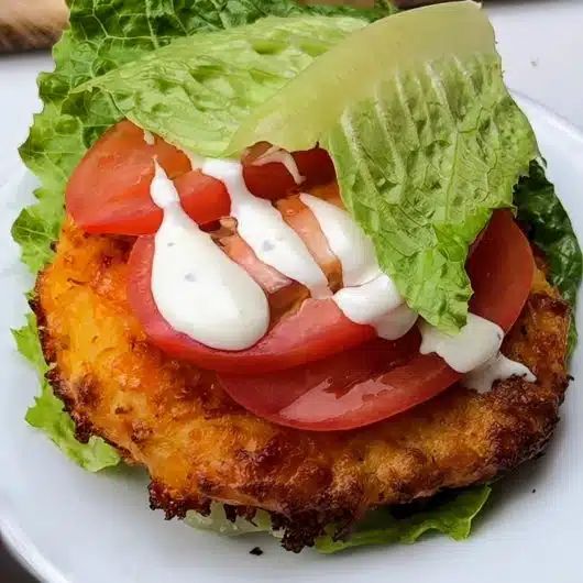 a close up of a plate of food with lettuce and tomatoes on it