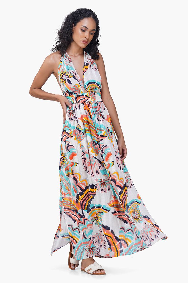 Cotton printed fabric Cool summer print maxi dress Elasticated waist all around belt for a comfortable fit Backless design adds allure Front halter tie dori knot for adjustable neckline Gathers at waist create a flattering silhouette Full length dress for a graceful look Side slits for added movement and style Our Sunflora Maxi Dress is a captivating blend of beauty and vibrancy, exuding charm and sophistication effortlessly. Crafted from luxurious fabric, its colorful print adds a playful yet e Multicolor Maxi Halter Dress For Beach Season, Multicolor Maxi Halter Dress For Vacation, Multicolor Maxi Length Halter Dress For Vacation, Beach Season Halter Neck Maxi Dress With Tie Back, Beachwear Halter Maxi Dress With Tie Back, White Maxi Dress With Vibrant Print For Summer, Beach Season Halter Maxi Dress With Tie Back, Beach Season Maxi Dress With Tie Waist, Multicolor Maxi Dress With Tie Back