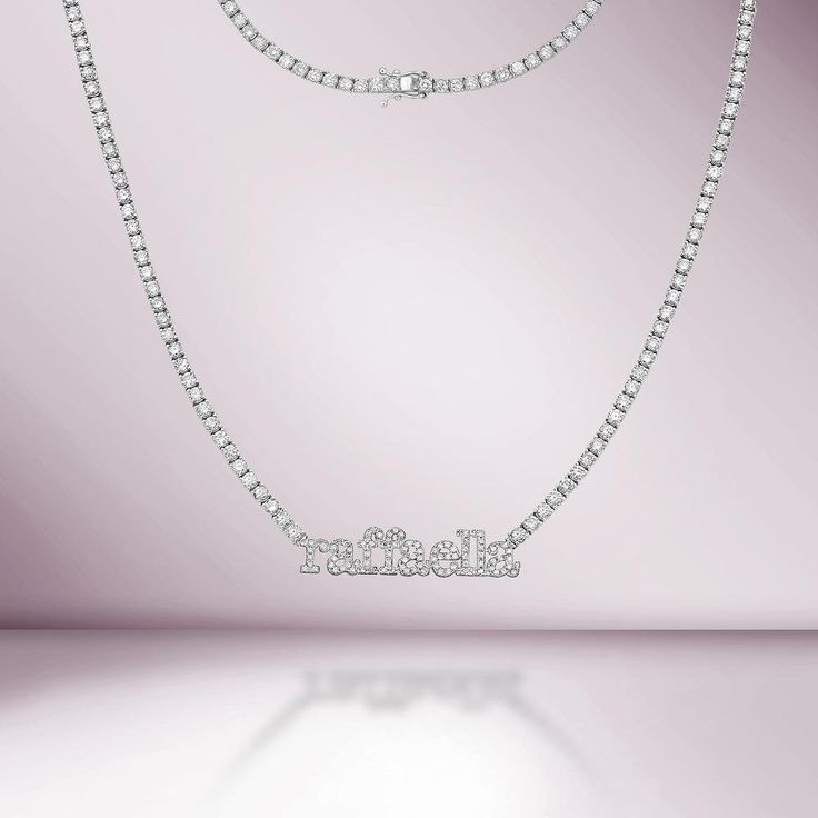 Handmade in New York of polished 14k white gold, CAPUCELLI's  Name Plate Custom Tennis necklace showcases a delicate box chain embellished with dozens of shimmering white diamonds and your choice of lower-cased diamond-set names on a 1.70mm wide diamond tennis necklace. Quality to us is important and that is why we han Classic Diamond White Necklace With Rhinestones, Classic Rhinestone Diamond White Necklace, Moissanite Tennis Necklace In White Gold With Prong Setting, Dazzling Diamond Tennis Necklace With Prong Setting, White Gold Moissanite Tennis Necklace With Prong Setting, Diamond Tennis Necklace With Rhinestones For Gift, White Gold Tennis Necklace With Diamond Accents And Crystal, Iced Out Diamond Necklace For Anniversary, Classic Diamond Necklace With Rhinestones