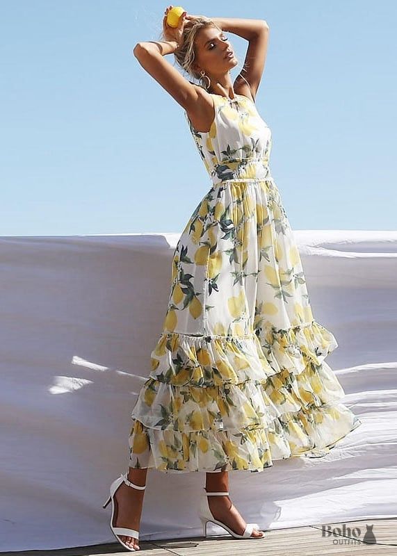 Lemon Printed Boho-Chic Fairytale Maxi Dress! This gorgeous women's ruffled maxi dress will add a feminine touch to your spring and summer outfit. It's made of cloth with a high polyester content. This dress has a relatively full skirt for a broad range of mobility. This is the epitome of bohemian chic at its finest! The lemon print is gorgeous, and the fabric is soft and lightweight, so you'll be comfy all day. This boho fairytale maxi dress has a loose fit and a casual vibe, ideal for summer d Sukienki Maksi, Printed Long Dresses, Sleeveless Dress Summer, Summer Party Dress, Boho Maxi, 가을 패션, Boho Maxi Dress, Ladies Dress Design, Flower Dresses