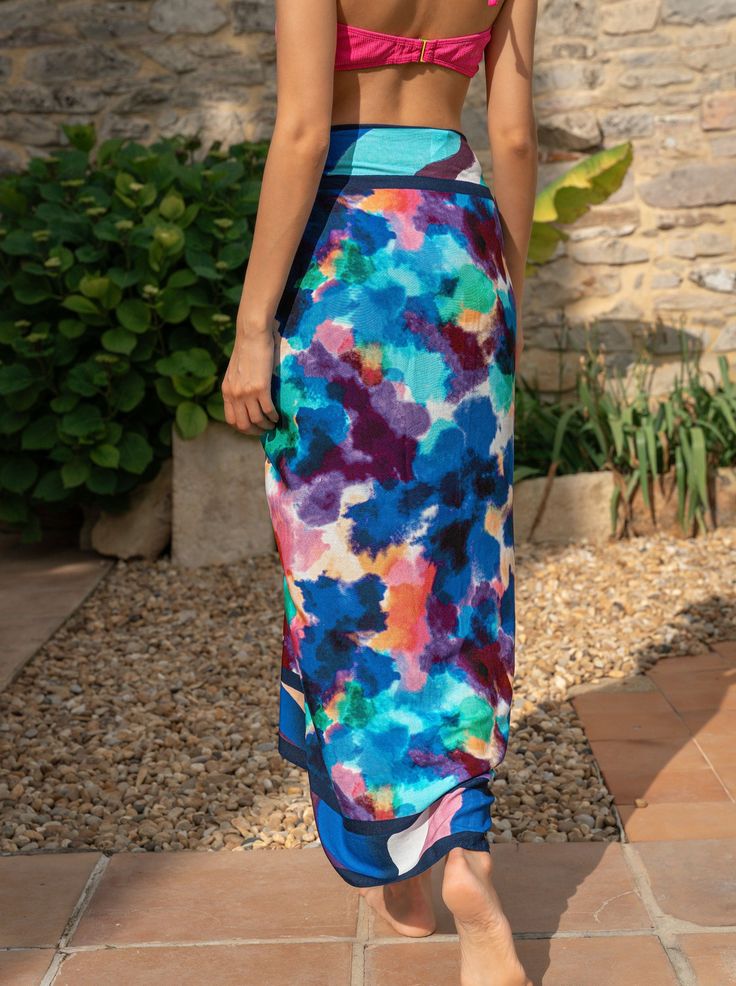 Meet the Melanie Pareo, your go-to layer for beach days and poolside lounging. Generously sized and crafted from soft, breathable rayon, it’s easy to tie and re-tie as you move from sun to shade. Wear it as a sarong skirt, knot it as a chic cover-up, or wrap it around your waist—this versatile pareo is designed for wherever the day takes you. Finished with tassel trim for a touch of movement, it’s a must-have for every woman who’s in and out of the water and always on the go.Pairs perfectly with Blue Bottoms For Beach Cover-up In Beach Season, Beachy Wrap Cover-up For Poolside, Multicolor Summer Beach Cover-up Bottoms, Beachy Sarong For Poolside Spring, Casual Beach Cover-up With Tie-side Bottom, Casual Sarong For Beach Season Vacation, Casual Tie-side Bottom Beach Cover-up, Beachwear Bottoms For Warm Weather Vacation, Summer Vacation Sarong With Tie-side Bottom