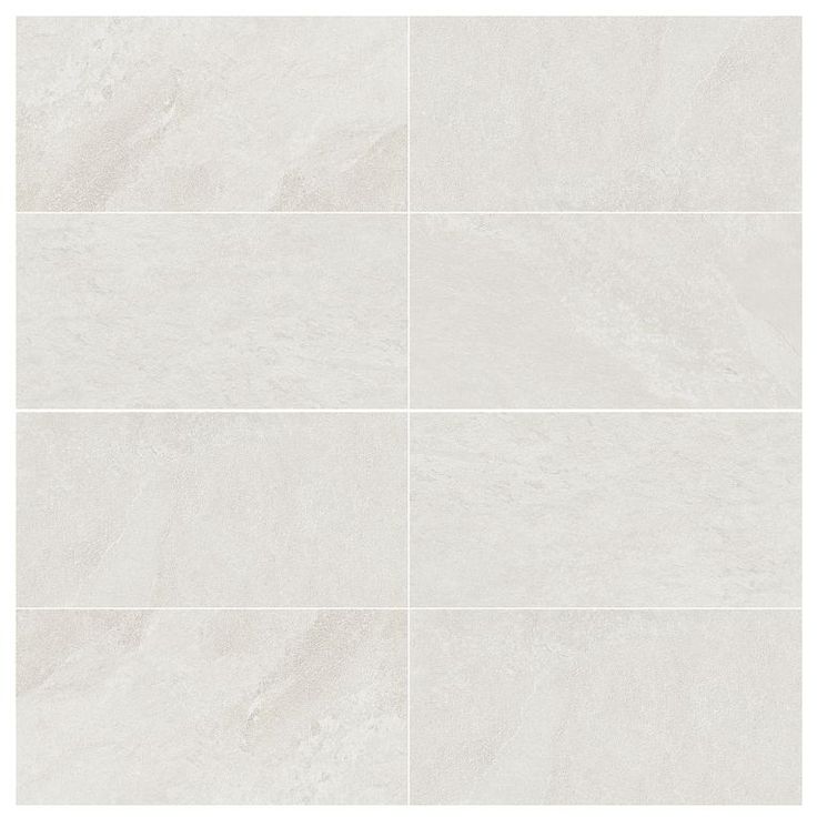 a white tile wall with four squares in the middle