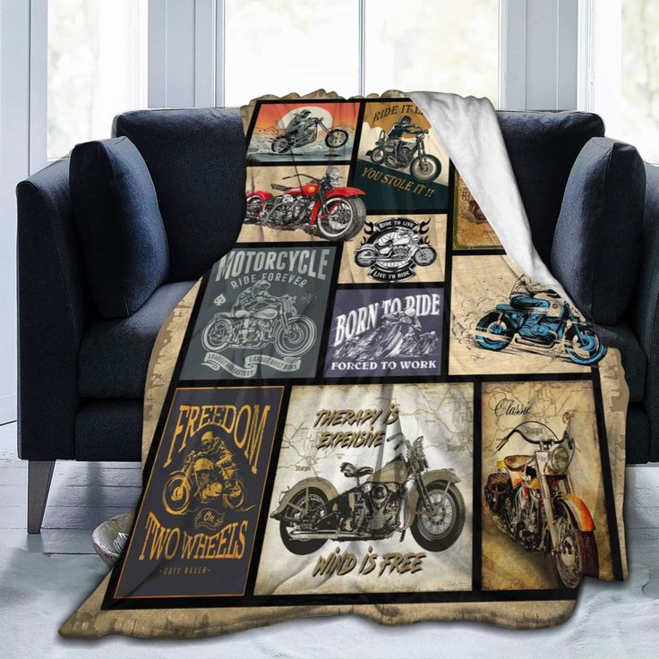 a couch with a motorcycle blanket on it