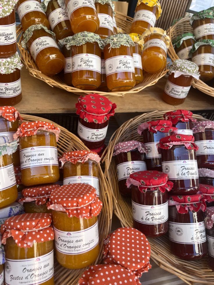 baskets filled with jams sitting next to each other