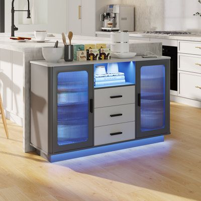 This all-in-one bar cabinet brings sophistication and functionality to your home bar, living room, or dining area. Crafted from engineered wood with a neutral finish, it features plenty of storage space with cabinets and drawers for all your entertaining essentials. This piece is equipped with over 20 LED light color options, allowing you to set the mood with a simple press of a button. A 3-in-1 charging station (wireless, wired USB port, and Type-C port) offers convenient and fast charging opti Home Bar Living Room, Bookshelf Brackets, Bar Living Room, Maximalist Home, Sewing Furniture, Globe Decor, Etagere Bookcase, Entertaining Essentials, Cozy Room Decor