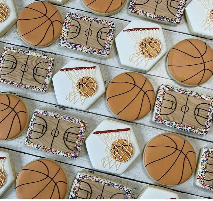 decorated cookies with basketballs and hoop on them are arranged in the shape of cookies