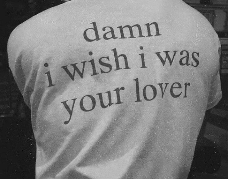 the back of a person wearing a t - shirt that says damn i wish i was your lover