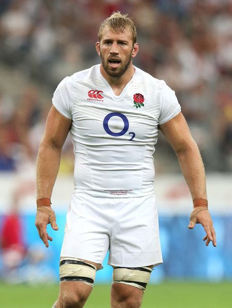 a rugby player is standing on the field