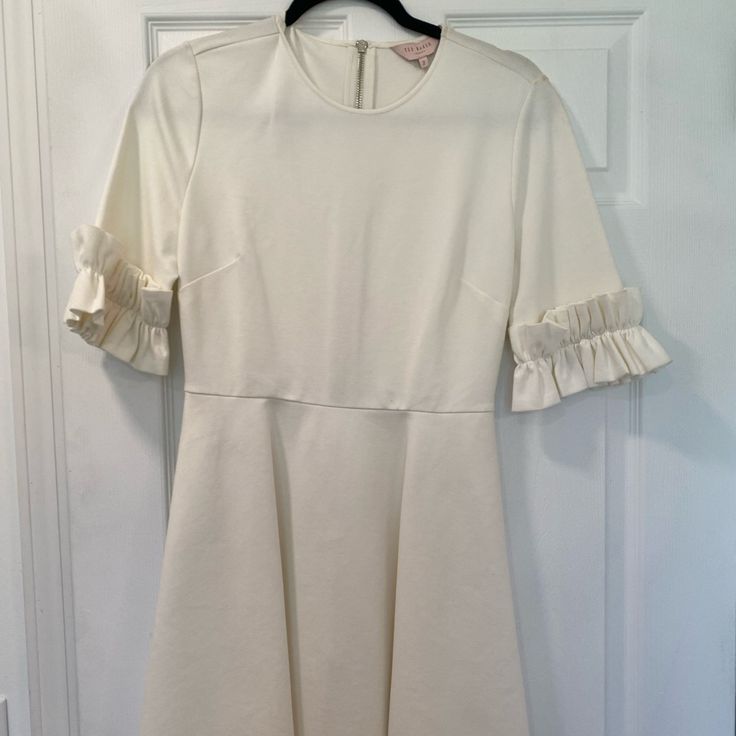 Never Worn (Nwot) Ted Baker Dress. Off White Color With Two Small Imperfections However, They May Come Out Of Spot Treat. White A-line Mini Dress With Ruffle Hem, Cream A-line Mini Dress For Brunch, White Lined Knee-length Midi Dress, White Knee-length Lined Midi Dress, White Lined Mini Dress With Short Sleeves, White Short Sleeve Lined Mini Dress, White A-line Lined Midi Dress, White A-line Midi Dress Lined, White A-line Midi Dress With Ruffles