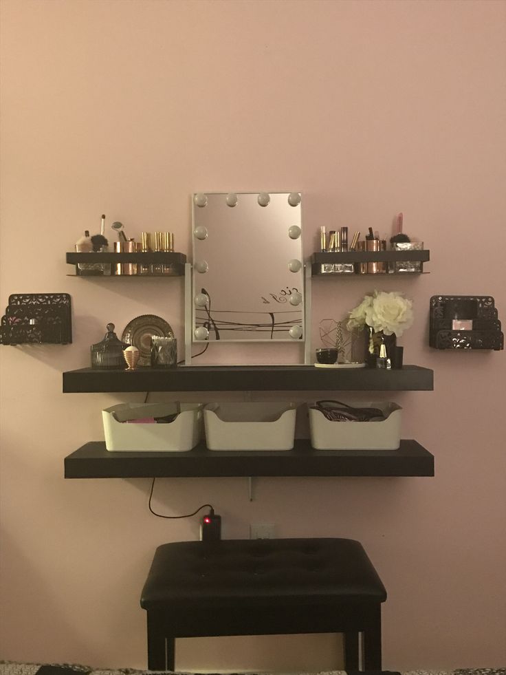 there is a mirror and shelves on the wall