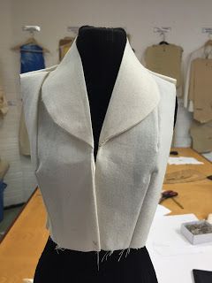 a mannequin with a white jacket on it