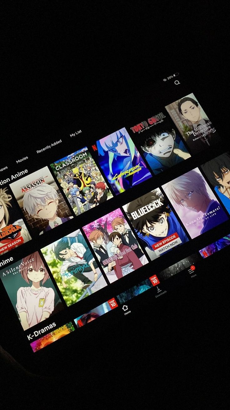 an image of anime on the screen of a cell phone that's lit up