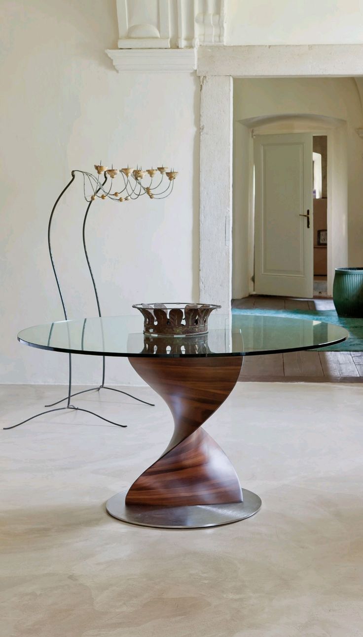 a glass table sitting in the middle of a living room