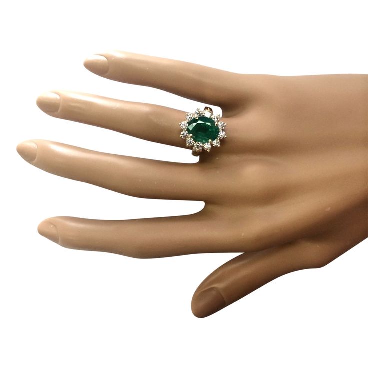 Stamped: 14K Yellow Gold Total Ring Weight: 5.2 Grams Ring Length: N/ARing Width: N/A Gemstone Weight: Total Natural Emerald Weight is 3.33 Carat (Measures: 10.55x8.50 mm) Color: GreenDiamond Weight: Total Natural Diamond Weight is 1.00 Carat Quantity:12 Color: F-G, Clarity: VS2-SI1 Face Measures: 16.65x14.50 mm Sku: [703872W] Formal Round Emerald Diamond Ring, Formal Emerald Birthstone Ring With Center Stone, Formal Brilliant Cut Emerald Ring, Formal Diamond Ring With Prong Setting For May Birthstone, Formal Emerald Cluster Ring With Accent Stones, Formal May Birthstone Diamond Ring With Prong Setting, Luxury May Birthstone Ring For Formal Occasion, Formal Green Cubic Zirconia Halo Ring, Formal May Birthstone Emerald Ring With Round Stone