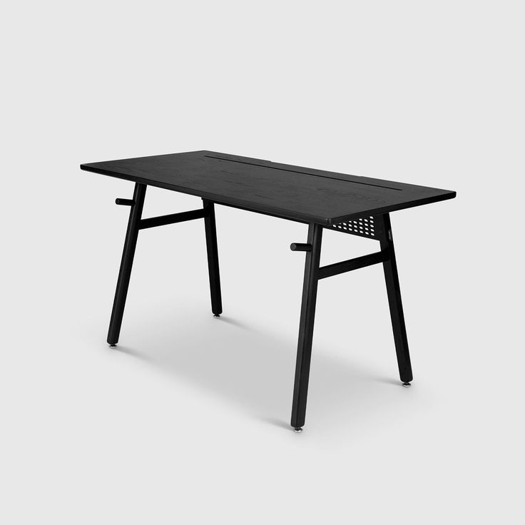 a black table sitting on top of a white floor