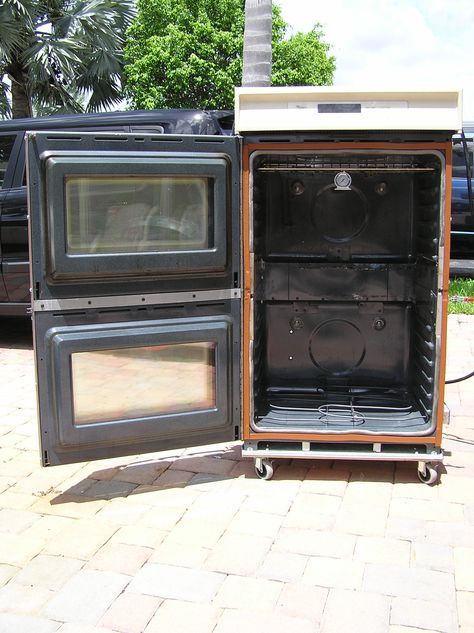 two old fashioned ovens sitting side by side