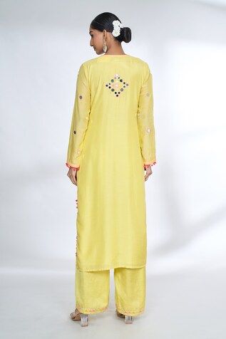 Yellow front gathered kurta with mirror embroidered yoke and sleeves with potli borders. Comes with coordinating palazzo. - Aza Fashions Yellow Straight Kurta With Mirror Work, Bohemian V-neck Kurta With Mirror Work, Bohemian Floor-length Kurta With Dabka Details, Fitted Yellow Kurta With Embroidered Border, Yellow Bohemian Kurta With Cutdana, Mithila Palkar, Gopi Vaid, Yellow Mirror, Yellow Kurta