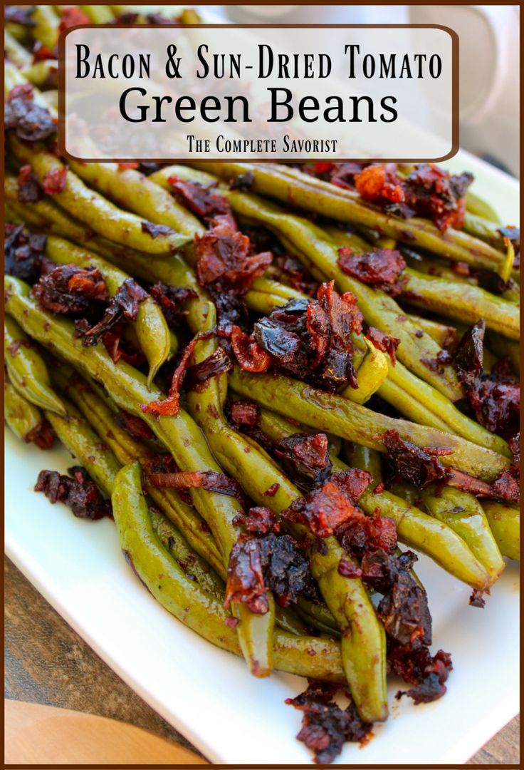 bacon and sun dried tomato green beans on a white plate with the title above it