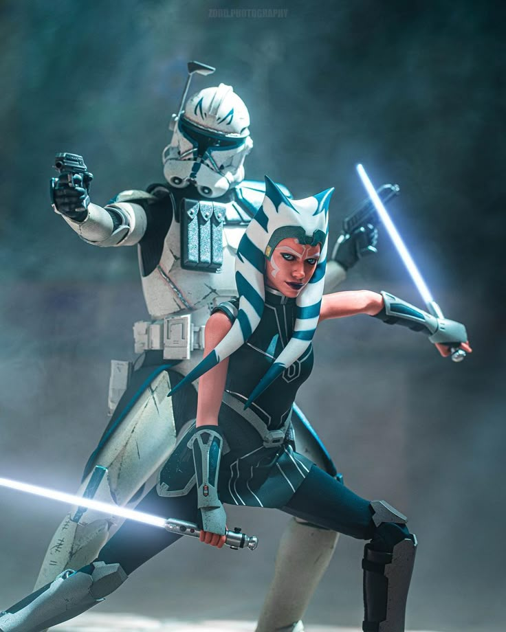 two people dressed as star wars characters in action