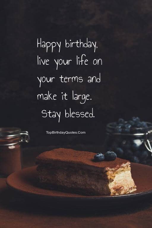 a piece of cake sitting on top of a plate next to a jar of blueberries