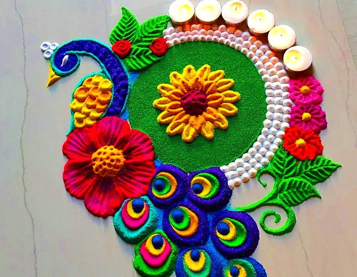 a colorful rang art work with candles and flowers