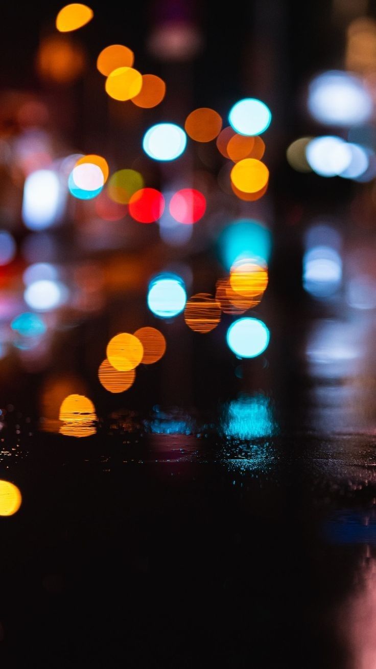 blurry photograph of city lights at night