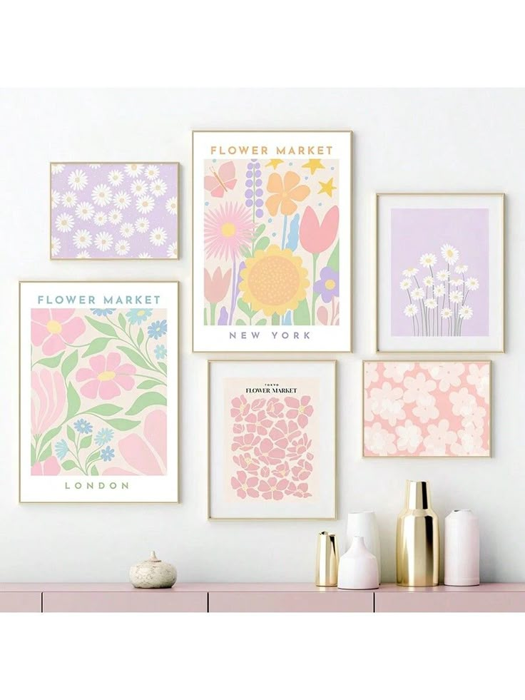 four flower market posters hanging on the wall above a pink dresser with vases and bottles