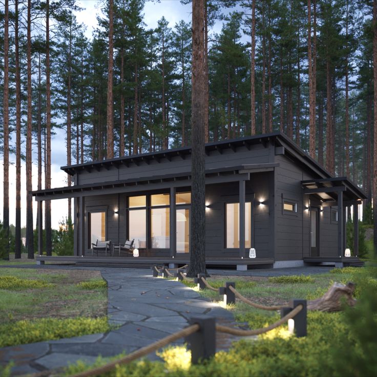 a small cabin in the middle of a forest with lights on it's windows