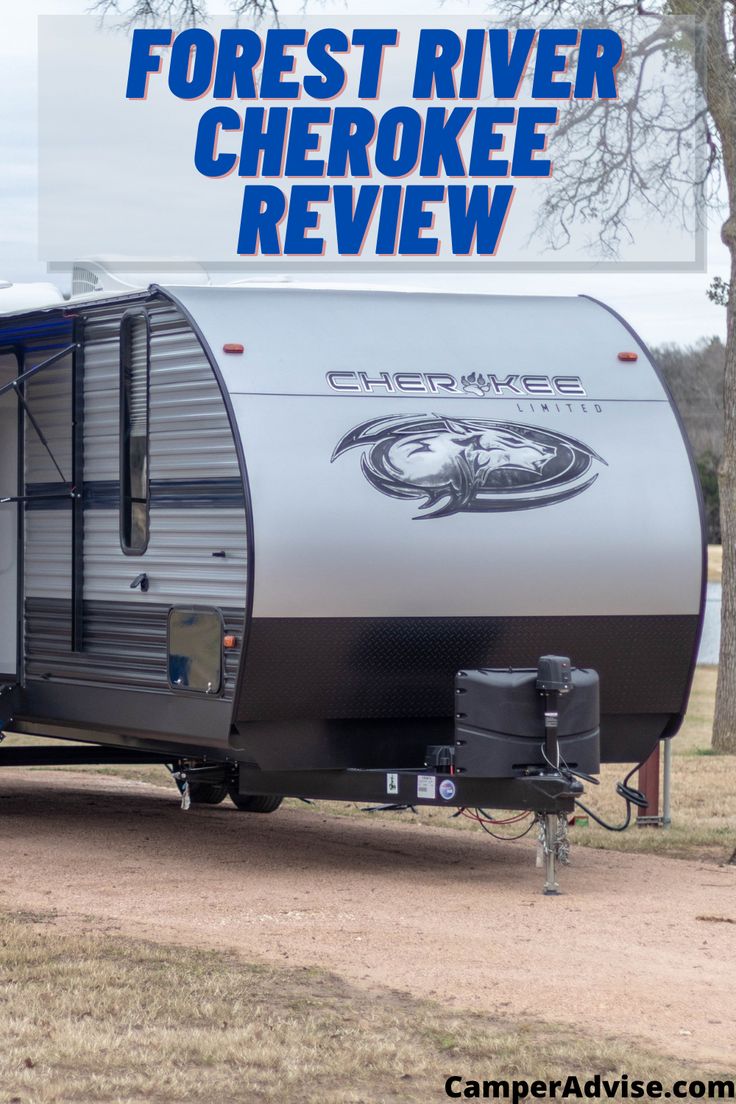 the forest river cheroke travel trailer is parked in front of trees and grass