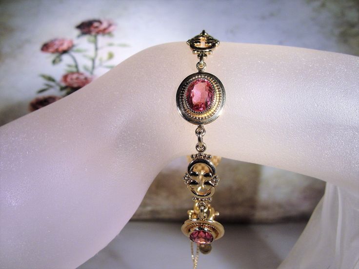 "This is a beautiful rose pink bracelet that is 14k Gold Filled. There are 4 oval cut faceted rosy pink glass gems with a decorative scroll link in between each. The look is stunning! Size of the bracelet is 7.25 inches. It has a round twist closure and a safety chain that is also able to be released and attached with the same type of closure. *Hang Tag reads: AMCO, 1/20 14K Gold Filled *Length is 7.25 inches *Width is .5 inches *Condition is Excellent = in \"LIKE NEW\" Condition; Pre-owned To v Pink Gold Formal Fine Jewelry Bracelets, Formal Pink Gold Bracelet, Formal Pink Bracelets In Fine Jewelry Style, Classic Pink Bracelet Jewelry, Pink Bracelet For Anniversary, Pink Fine Jewelry Bracelets For Formal Occasions, Pink Fine Jewelry Bracelet For Formal Occasions, Pink Bracelets For Formal Occasions, Elegant Rose Gold Bracelet For Formal Occasions