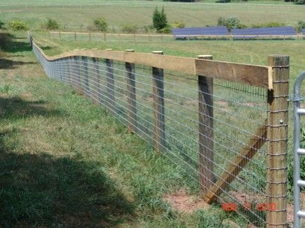 a fence that is next to a field