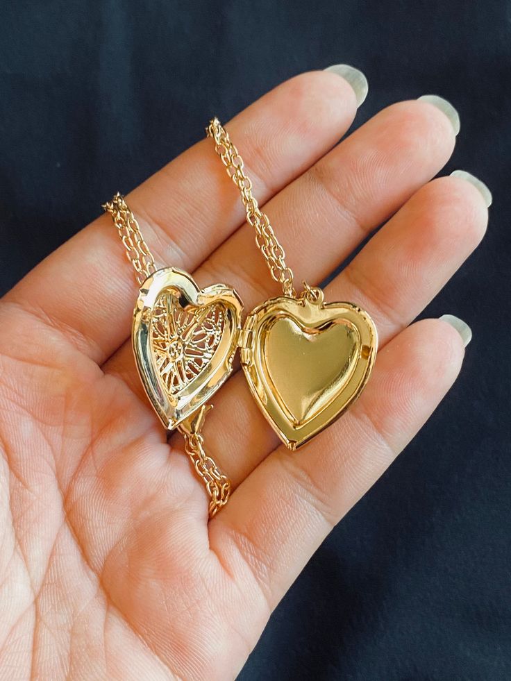 Gold (not real) heart locket necklace, length is 20 inches. Valentine's Day Heart Cut Locket Necklace With Heart Charm, Valentine's Day Heart Shaped Locket Necklace With Charm, Heart Pendant Locket Necklace For Valentine's Day, Heart Pendant Locket Necklace As Keepsake, Heart Pendant Metal Locket Necklace For Keepsake, Heart Shaped Locket Necklace For Keepsake, Heart Cut Locket Necklace For Keepsake, Heart Locket Necklace For Valentine's Day, Open Heart Locket Necklace For Keepsake