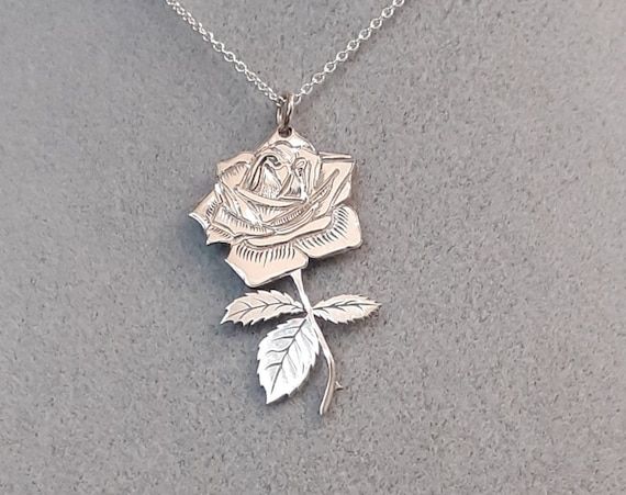 Hey, I found this really awesome Etsy listing at https://www.etsy.com/listing/767406959/silver-rose-pendant-necklace Sterling Silver Birth Flower Jewelry For Anniversary, Rose Gold Sterling Silver Necklace, Rose Sterling Silver Jewelry For Mother's Day, Rose Colored Round Pendant Jewelry For Gift, Sterling Silver Rose Design Necklace For Weddings, Silver Spiritual Necklace For Anniversary, Rose Pendant Jewelry For Her, Silver Birth Flower Necklace For Anniversary, Rose Nickel Free Jewelry For Gift