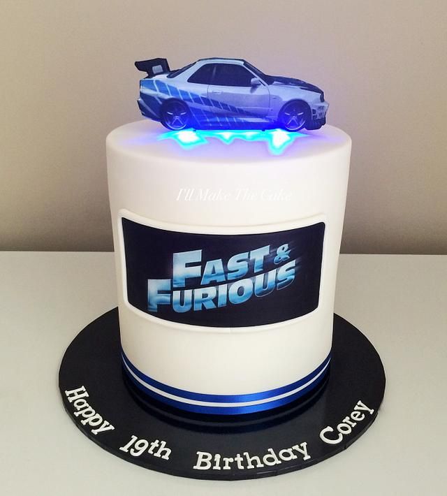 a birthday cake with a car on top