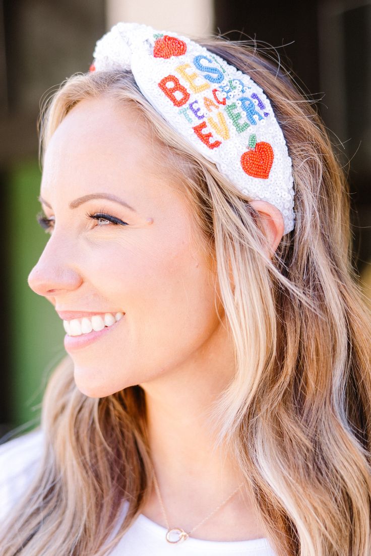 This headband in white is the cutest and trendiest way to show your appreciation to your child's favorite educator! With its beaded design, it's not only a great gift idea but also a fashionable accessory! Treat yourself or that special teacher in your life! Adjustable Novelty White Headband, Trendy Adjustable Headband For Gift, Playful Adjustable Hair Accessories For Gifts, Fun Adjustable Headband For Gifts, Fun Adjustable Headband For Gift, Fun Adjustable Headband As Gift, Cute White Headband For Birthday, Cute White Birthday Headband, Trendy White Hair Accessories For Summer