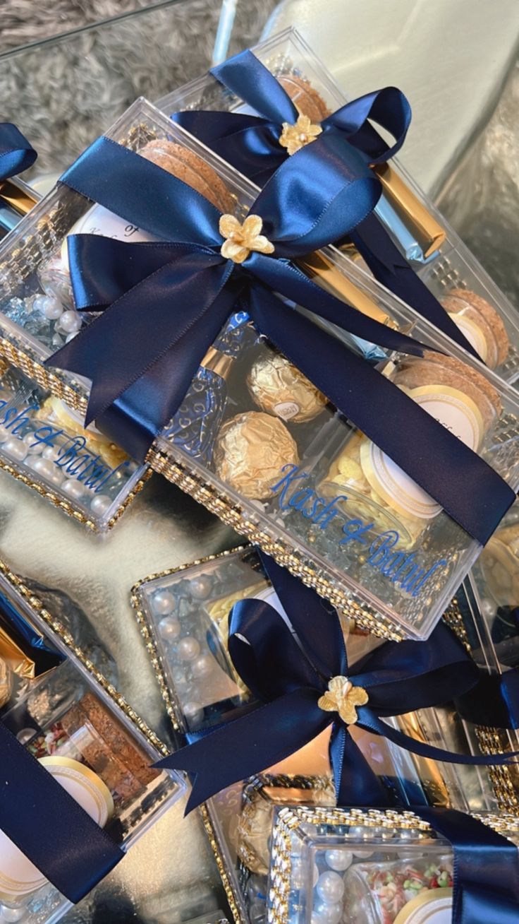 a box filled with lots of different types of cookies and candies on top of a table