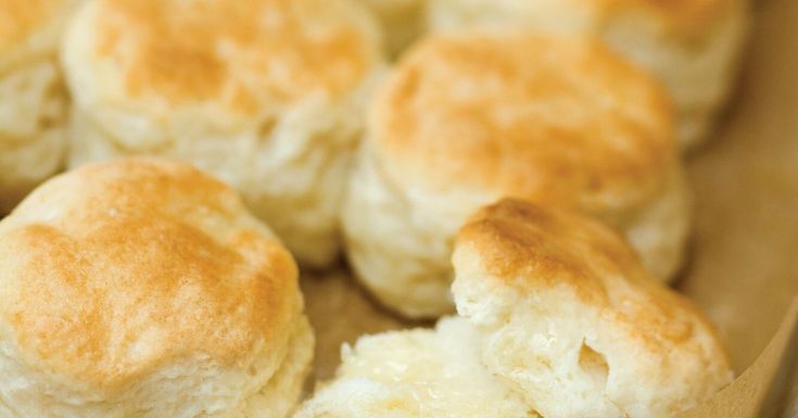 several biscuits sitting on top of a piece of parchment paper