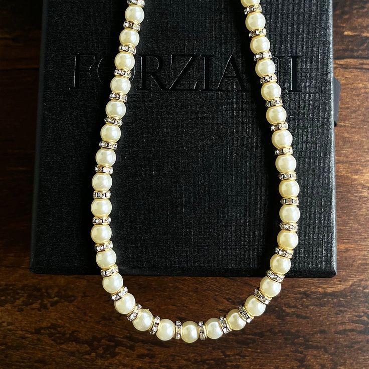 Step into a new era of sophistication with our highly anticipated 5mm Pearl Rondelle Necklace showcasing a full string of genuine ivory pearls with gold detailing. Wear this men’s pearl chain with a matching pearl bracelet for a style that’s hitting top of the charts currently with celebrities and professional athletes. Our Men's Pearls Collection, features sophisticated fresh water pearl necklaces and bracelets, designed especially for men. Drawing inspiration from historical royalty who layere Elegant Cream Pearl Jewelry, Formal Cream Pearl Drop Jewelry, Classic Cream Pearl Jewelry, Elegant Cream Jewelry With Pearl Charm, Classic Cream Pearl Chain Necklace, Classic Adjustable Pearl Necklace For Party, Adjustable Pearl Chain Necklace For Formal Occasions, Classic Cream Pearl Necklace With Pearl Charm, Adjustable Pearl Charm Necklace For Formal Occasions